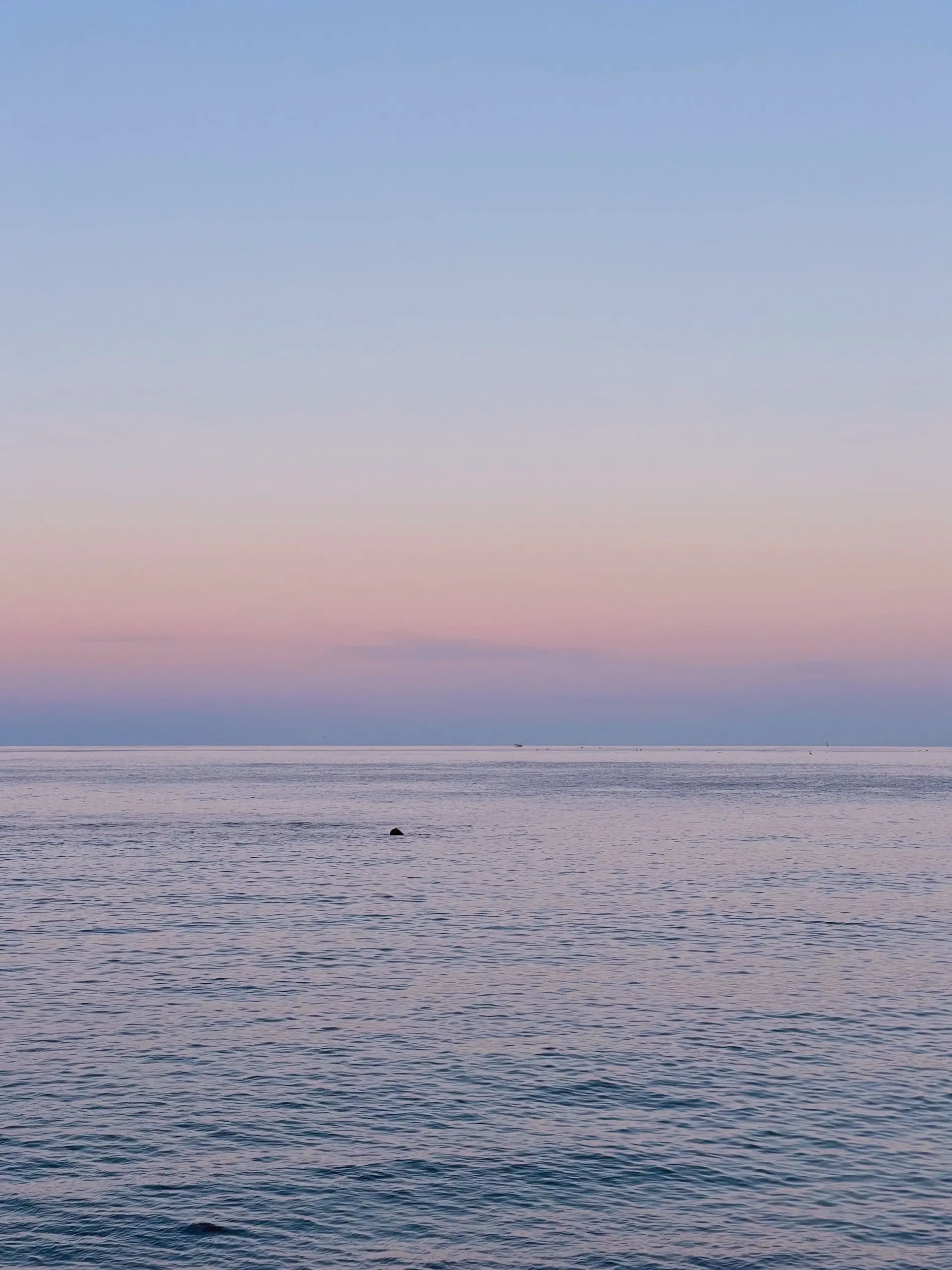 the beautiful blue sea at dusk, 2023