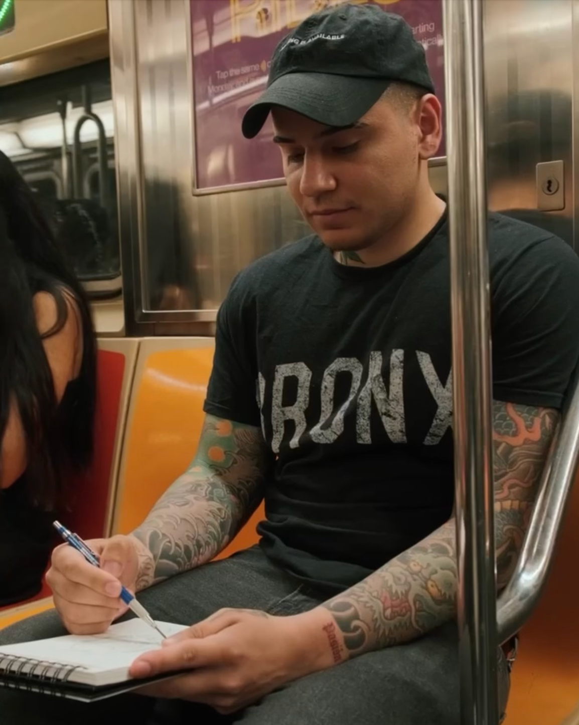Devon Rodriguez sketching a portrait on the MTA in New York City.