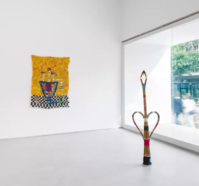 Installation view of works by Serge Attukwei Clottey and Mestre Didi in “The Speed of Grace,” curated by Larry Ossei-Mensah, at Simões de Assis, São Paulo. Court